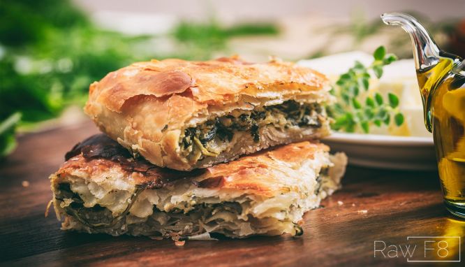 Greek savory pastry. It is filled with spinach, feta cheese, eggs, onions, and seasoning